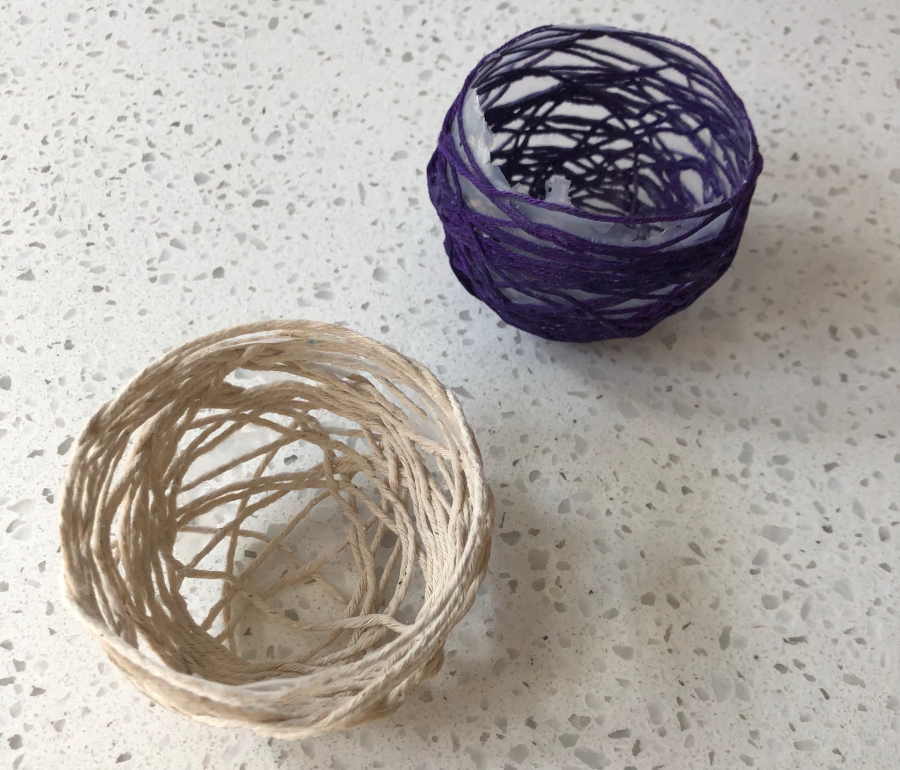 Two bowls are sitting on a table.