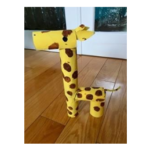 A giraffe made out of toilet paper rolls