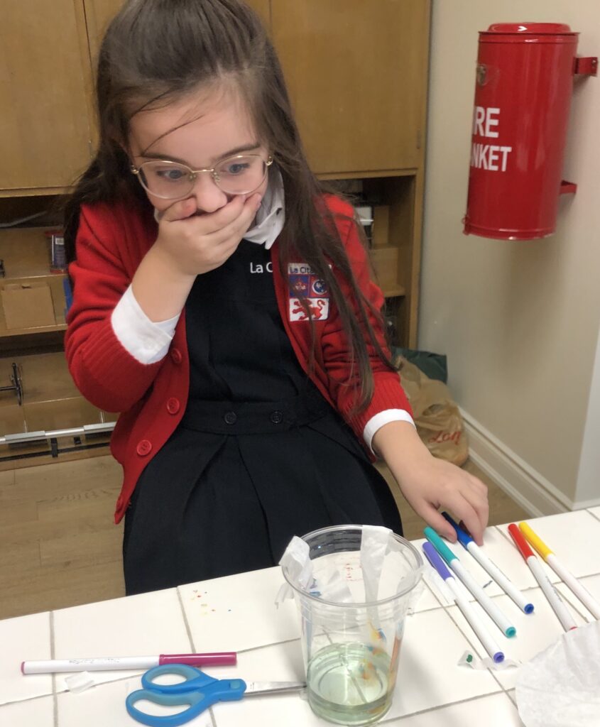 Girl surprised by her chromatography experiment