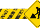 A yellow and black sign with an arrow