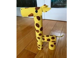 A giraffe made out of toilet paper rolls